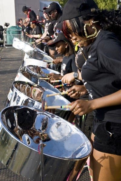 Steel-drummer from CIS Band Trust playing steel drums at the Notting Hill Panorama Championships - International Magazine Kreol Steel-drummer from CIS Band Trust playing steel drums at the Notting Hill Panorama Championships