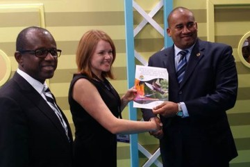 Pippa Jacks of TTG presents a copy of the European Industry Trends & Insight Report 2014 to CTO Chairman Richard Sealy with CTO SG Hugh Riley (L) looking on