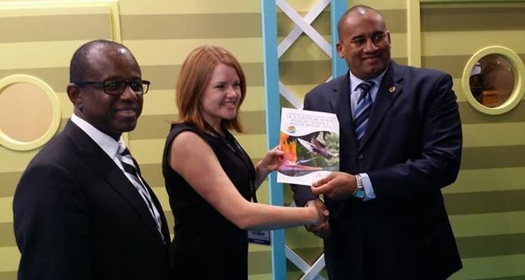 CTO_AWARD - International Magazine Kreol Pippa Jacks of TTG presents a copy of the European Industry Trends & Insight Report 2014 to CTO Chairman Richard Sealy with CTO SG Hugh Riley (L) looking on