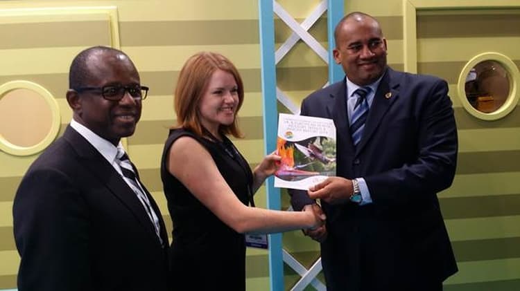 CTO_AWARD - International Magazine Kreol Pippa Jacks of TTG presents a copy of the European Industry Trends & Insight Report 2014 to CTO Chairman Richard Sealy with CTO SG Hugh Riley (L) looking on