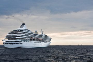 Big cruise ship leaves in the sea