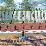 63 ceramic heads - International Magazine Kreol 63 ceramic heads, designed by Woodrow Nash, depicting the revolutionaries, mounted on steel rods along a pond designed to resemble a meander of the Mississippi River