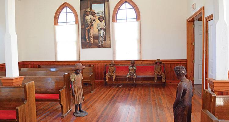Whitney Plantation - International Magazine Kreol Terra-cotta statues of child slaves are inside of a church at the Whitney Plantation