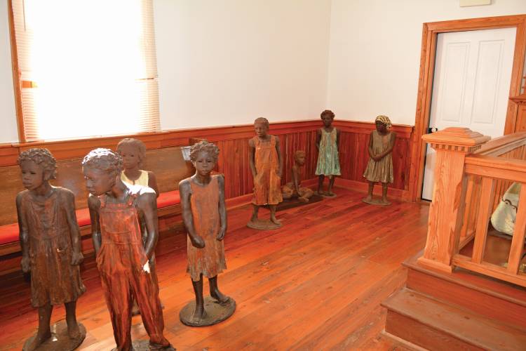 Whitney Plantation - International Magazine Kreol Statues by Woodrow Nash at the Whitney Plantation