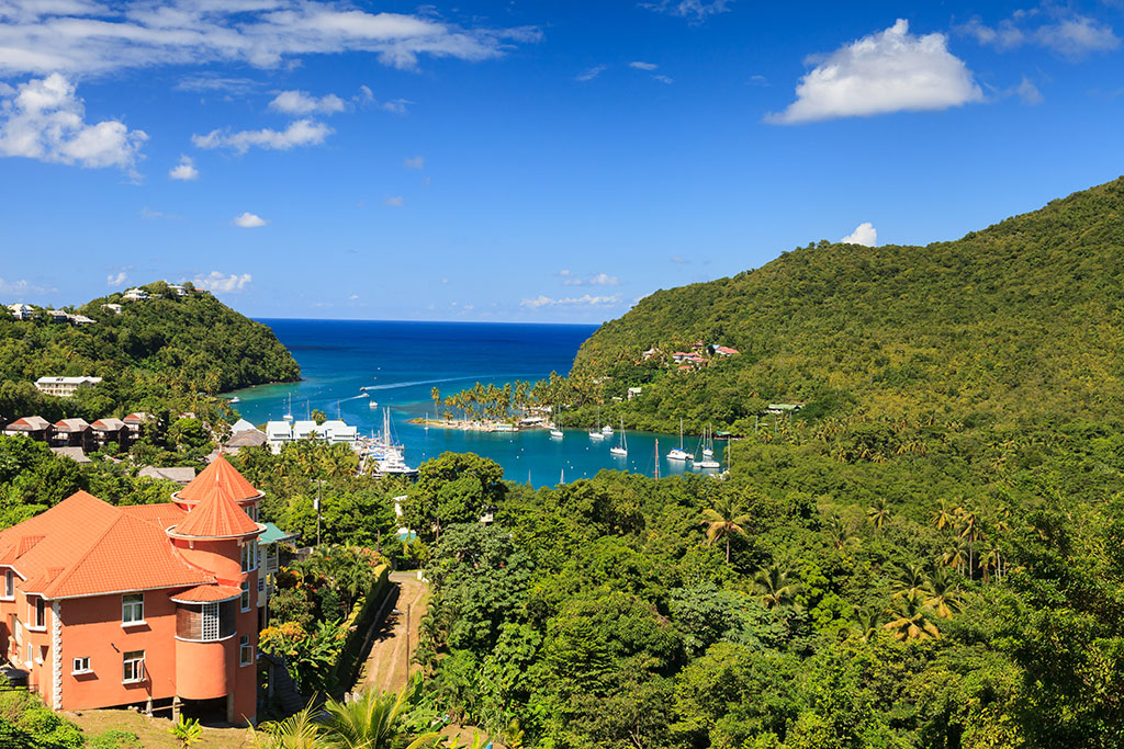 Marigot,Bay.,The,View,Across,Marigot,Bay,In,St,Lucia. - International Magazine Kreol Marigot Bay. The view across Marigot Bay in St Lucia. Marigot Bay is located on the west coast of the Caribbean island of St Lucia.