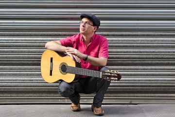 Luiz Morais Poses with guitar
