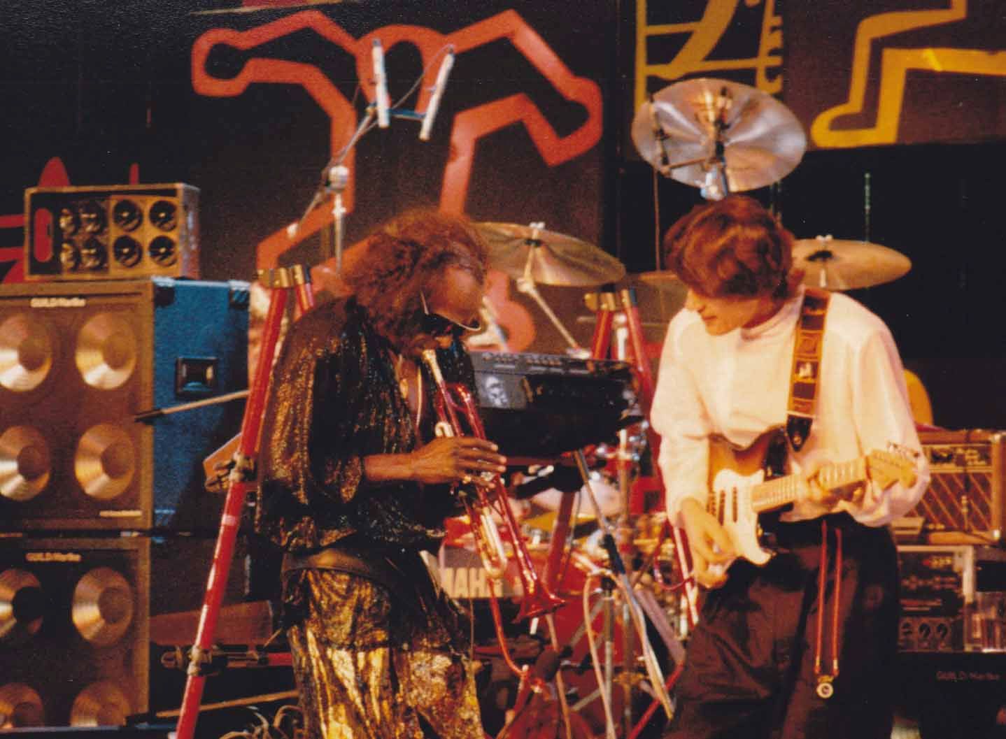 Miles Davis (left) jamming alongside Robben Ford (right) - Photography by Dr Jean Fortunet - International Magazine Kreol Miles Davis (left) jamming alongside Robben Ford (right). Blues Music. Two artists creating music - Photography by Dr Jean Fortunet