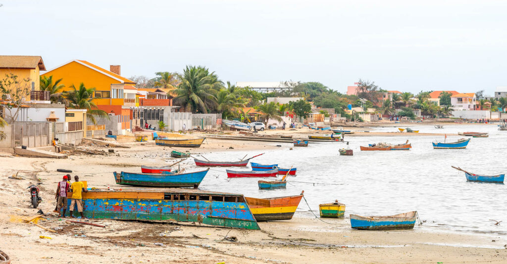 AngolaFishingTownRamirosFishermanBoatsAndFishForSale - International Magazine Kreol Angola Fishing town Ramiros, fisherman boats and fish for sale on the fish market in Angola West-Africa.