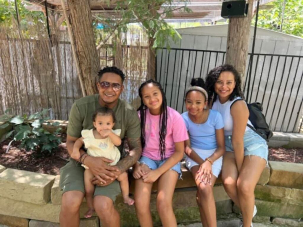 Christopher’s oldest son, Eric, with daughters Stella, Layla, and Emeri, and his wife, Stacy. - International Magazine Kreol Chris Andrus