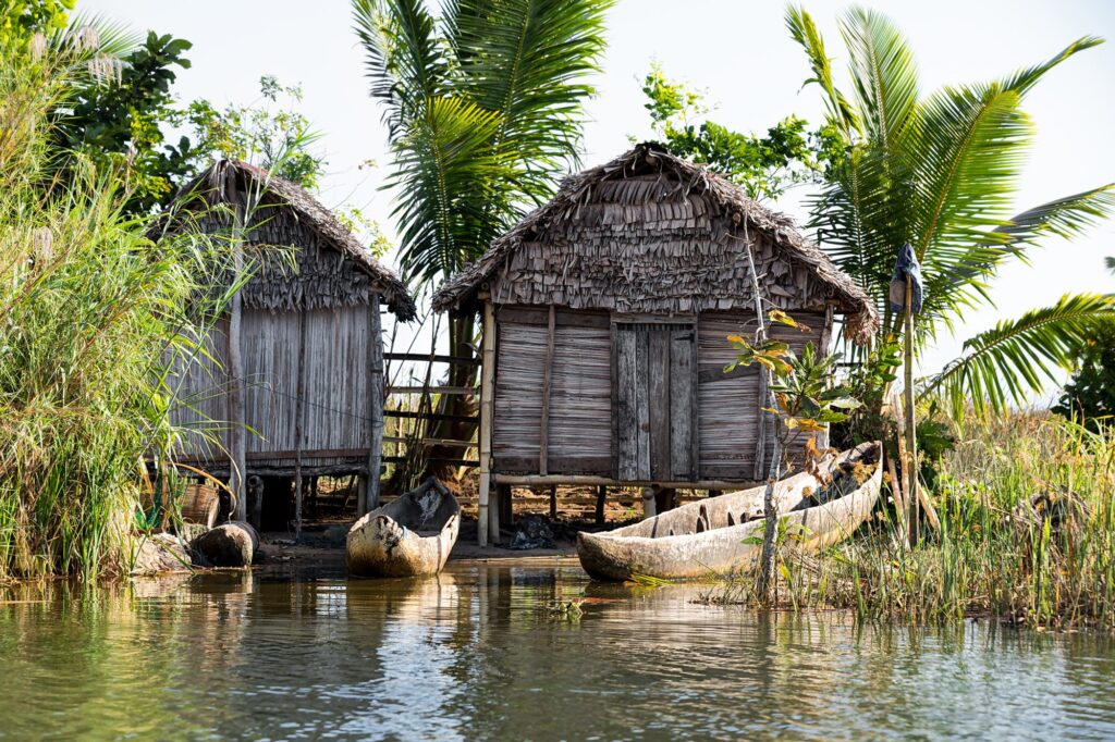 Madagascar traditional rural landscape with fisherman hut in Tamatave province near Maroantsetra city with traditional boat - International Magazine Kreol Exploring Creole Culture