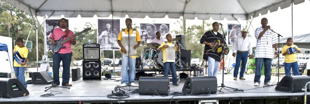 The Dog Hill Stompers at 2008 Festivals Acadiens et Créoles at Girard Park in Lafayette, LA. The group is composed of the grandsons of the late Boozoo Chavis, who lived at Dog Hill in Lake Charles, LA. - International Magazine Kreol Poncho & Rellis Chavis