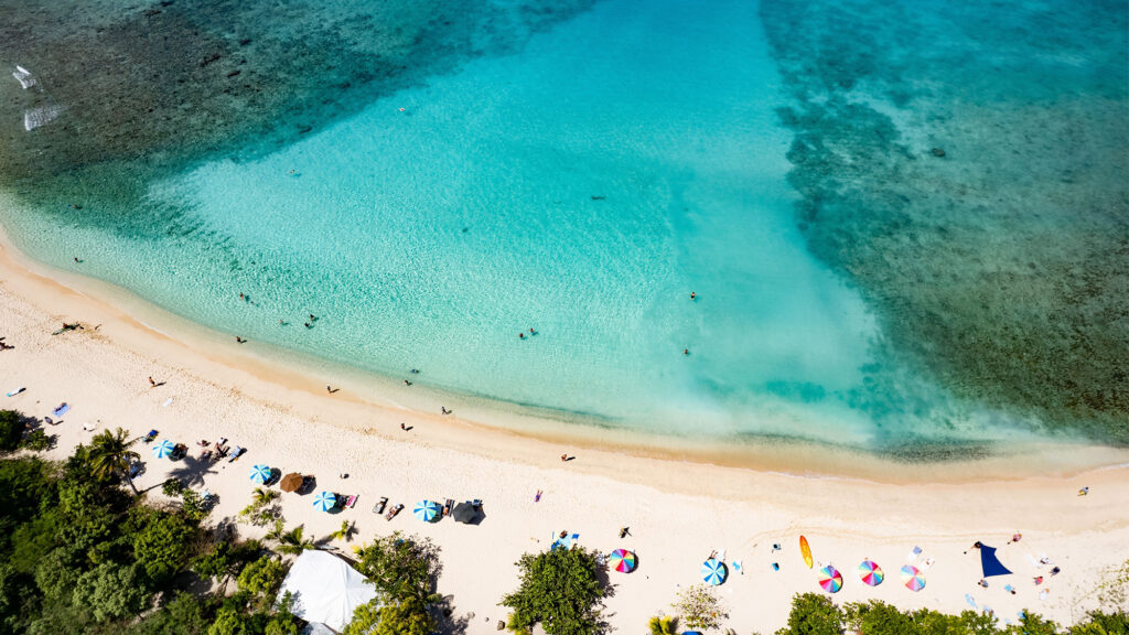 Aerial view of Smuggler’s Bay beach in Tortola, BVI. - International Magazine Kreol Aerial view of Smuggler’s Bay beach in Tortola, BVI.