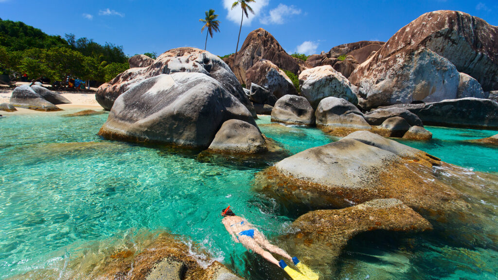 Turquoise tropical water among huge granite boulders at The Baths beach ON Virgin Gorda, BVI. - International Magazine Kreol Turquoise tropical water among huge granite boulders at The Baths beach ON Virgin Gorda, BVI.