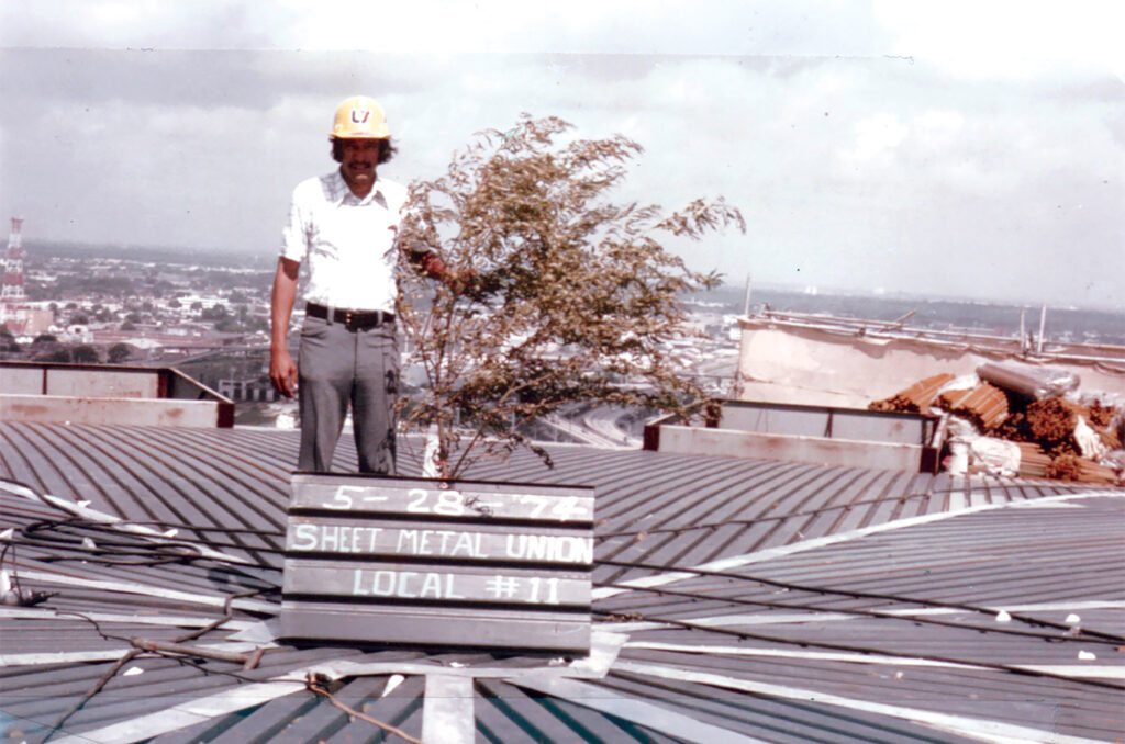 Rhaoul Guillaume on the roof of the Superdome during the construction, 1974. - International Magazine Kreol Rhaoul Guillaume on the roof of the Superdome during the construction, 1974.